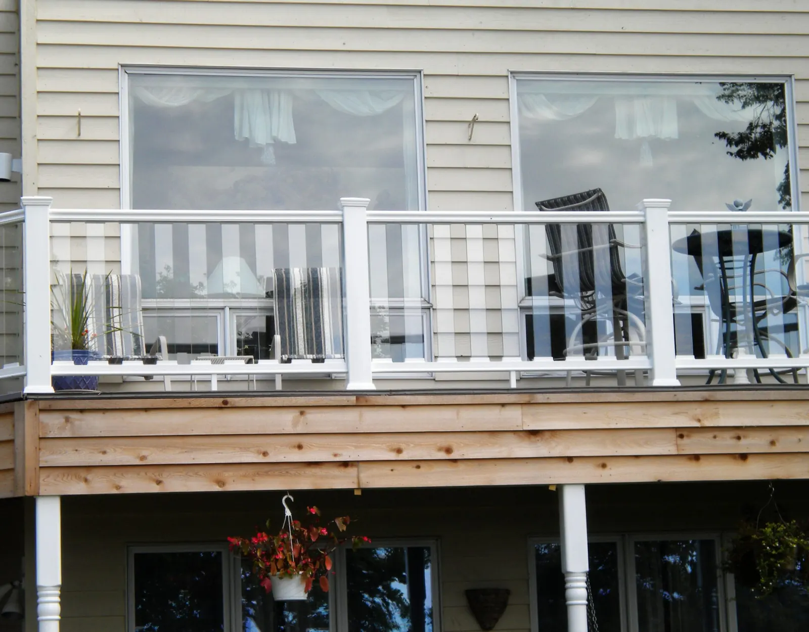 White Envision composite railing on a raised deck