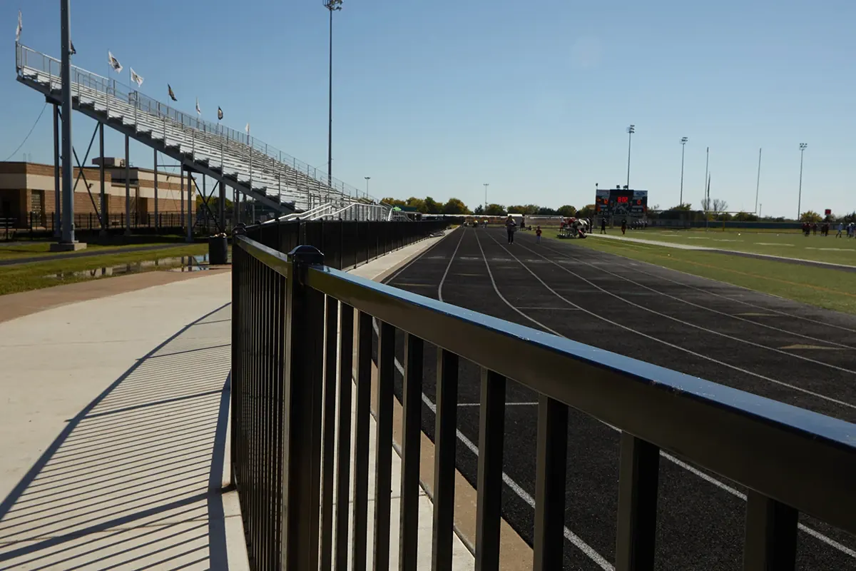 Fortress Athens aluminum fence along a school running track