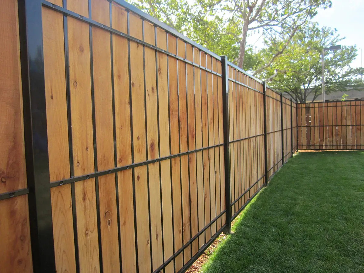 Fortress Estate privacy fence with a black steel frame and wood boards