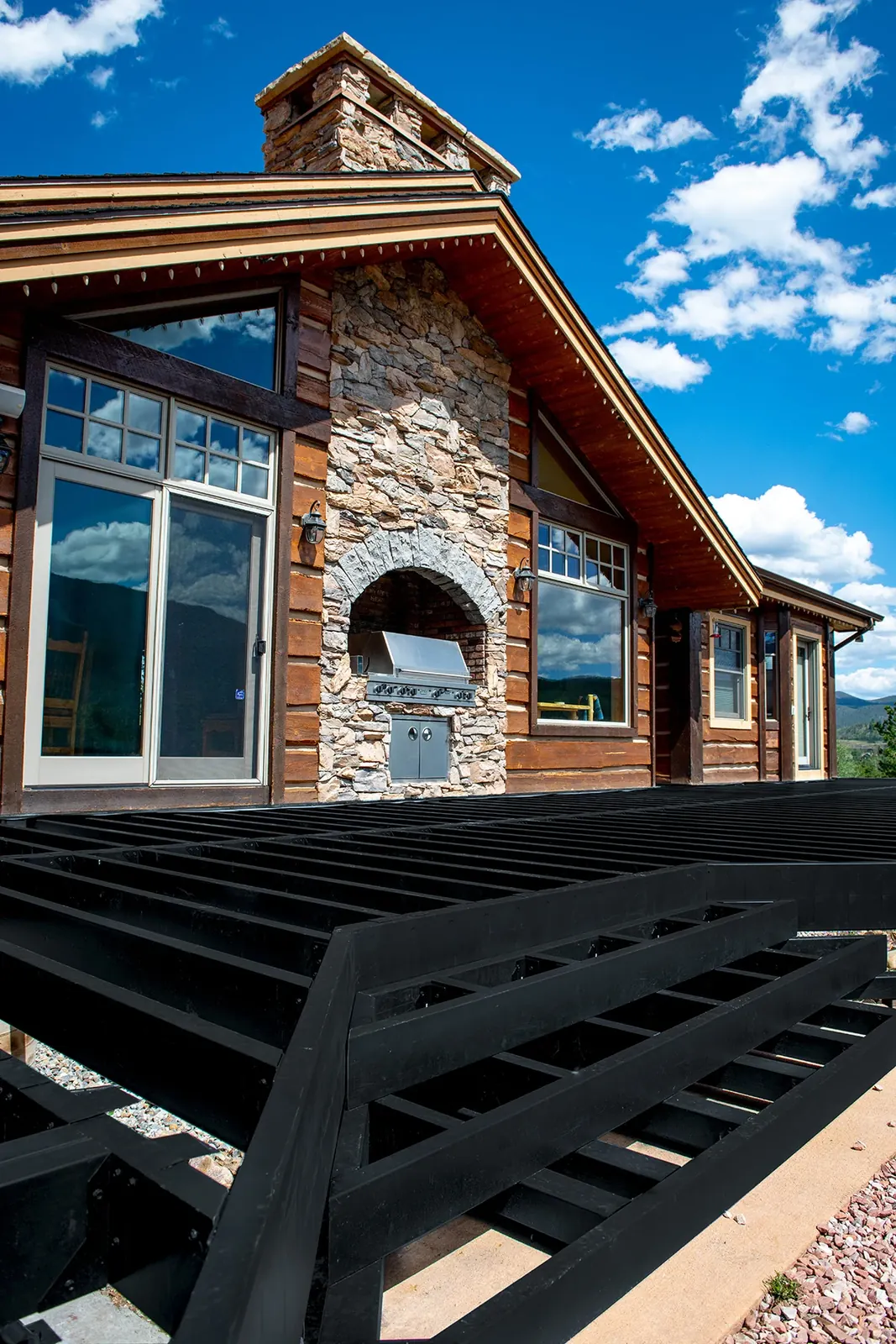 Fortress Evolution steel joists on a raised deck at a stone home
