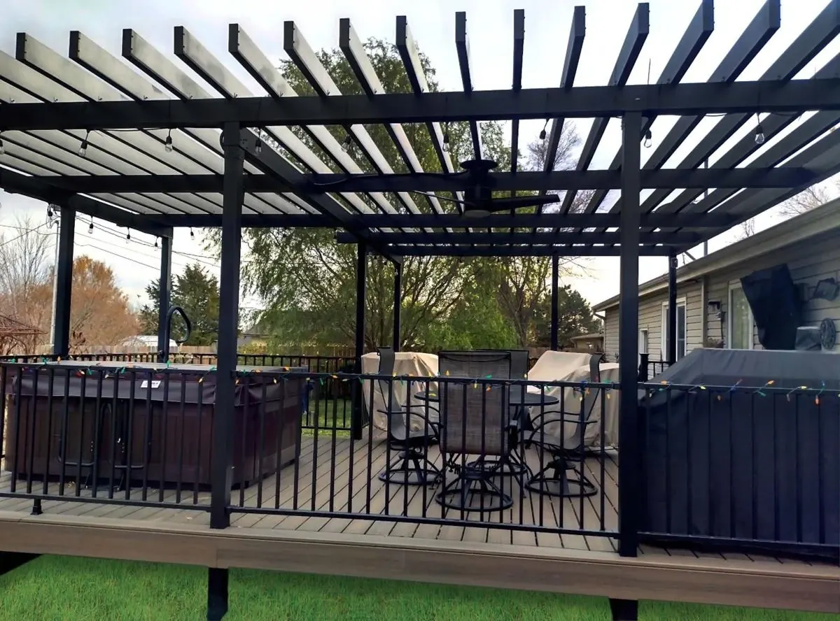 Steel pergola with railing on an elevated deck