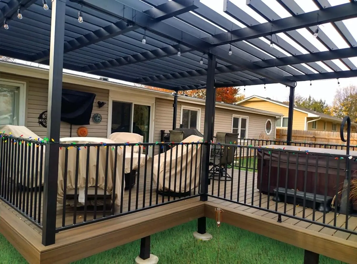 Composite deck with a Fortress steel pergola and black railing