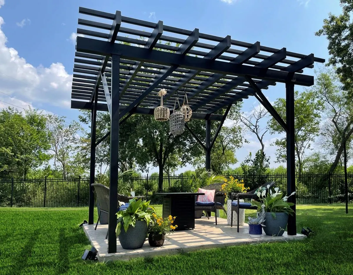 Black Fortress steel pergola over a backyard patio