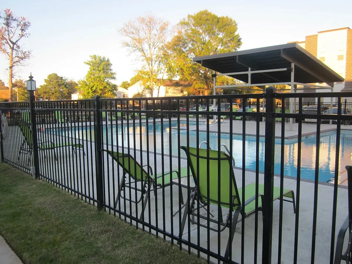 Fortress Versai steel fence around a resort-style pool