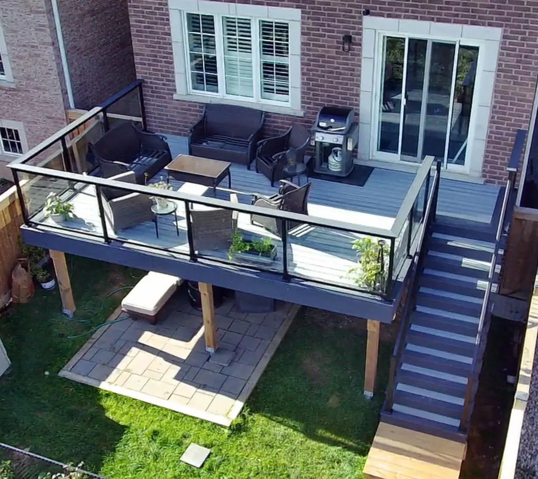 Raised deck with Vista framed glass railing and stairs