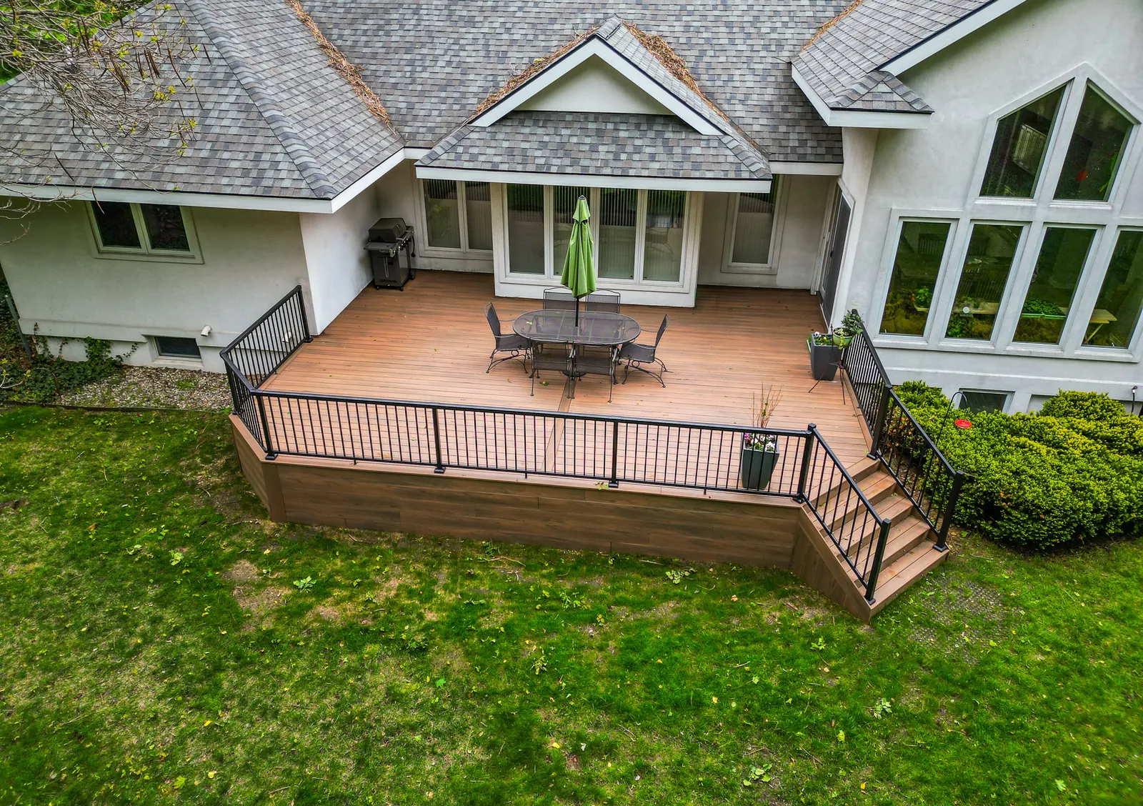 Aerial view of a backyard deck with Vista picket railing