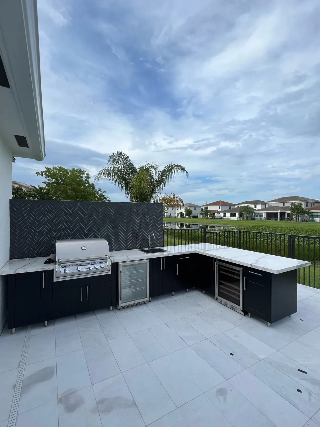 Black WeatherStrong L-shaped kitchen on a patio