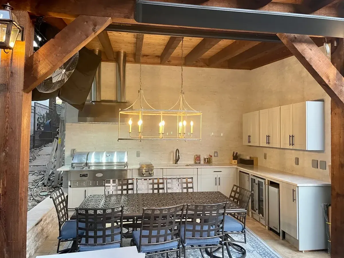 WeatherStrong kitchen and dining area under a timber pavilion