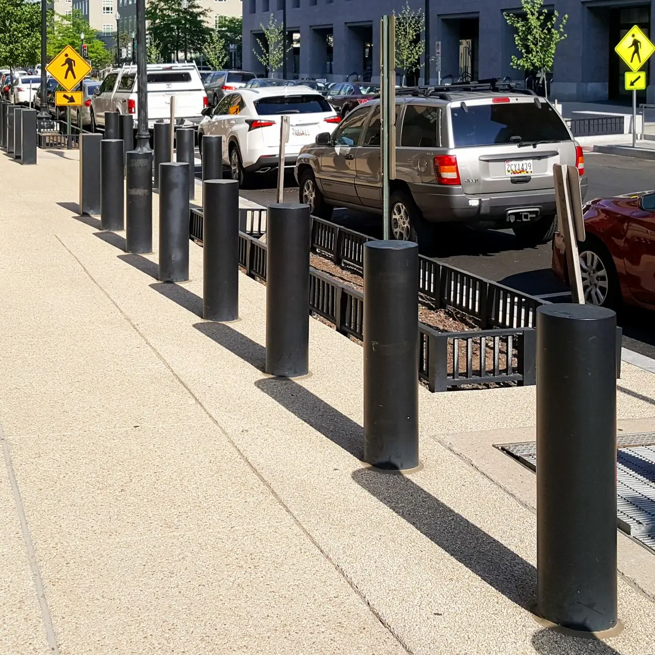 Row of Ameristar bollards on a city sidewalk