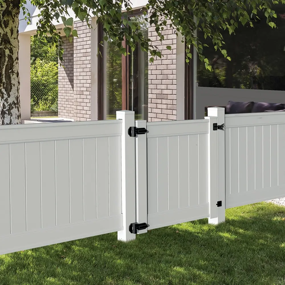 White vinyl privacy fence with pedestrian walk gate