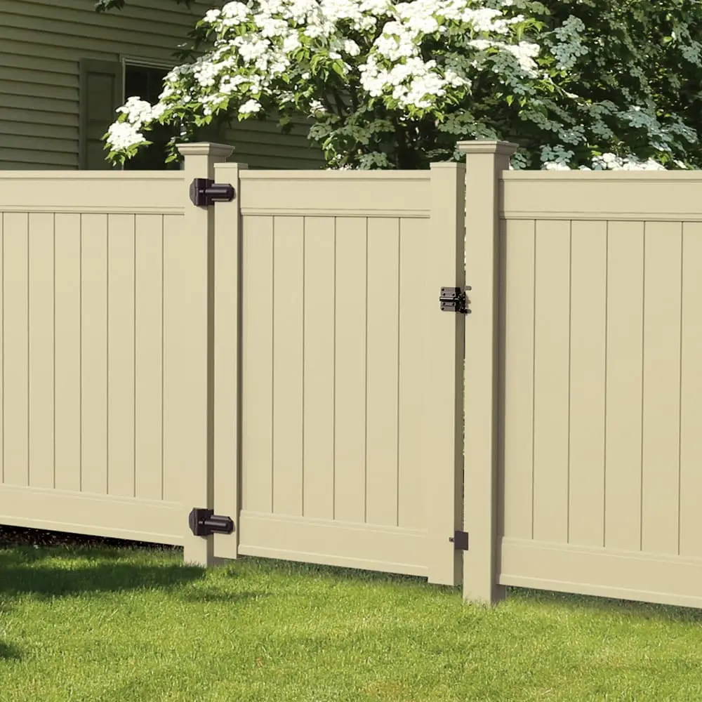 Tan vinyl privacy fence with walk gate