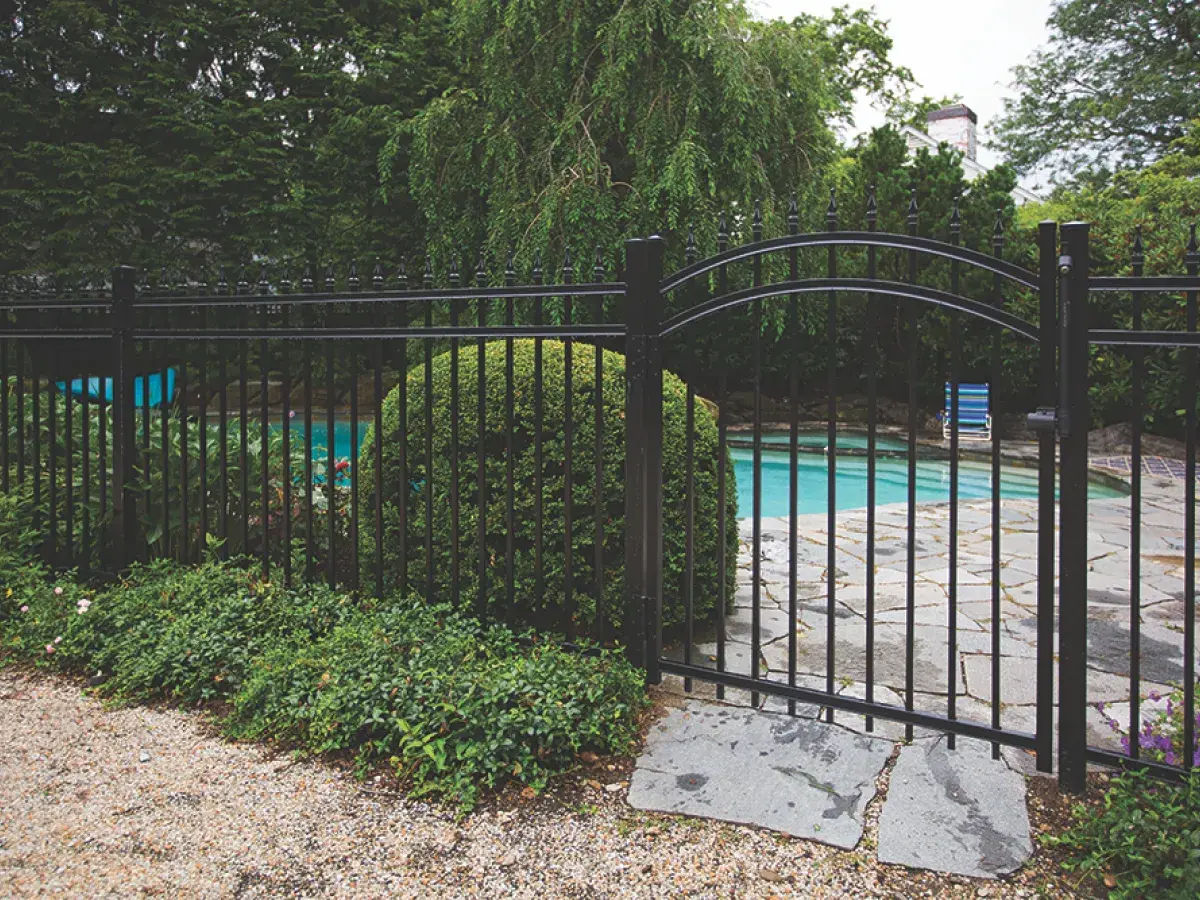Catalyst arched aluminum gate and fence by a pool