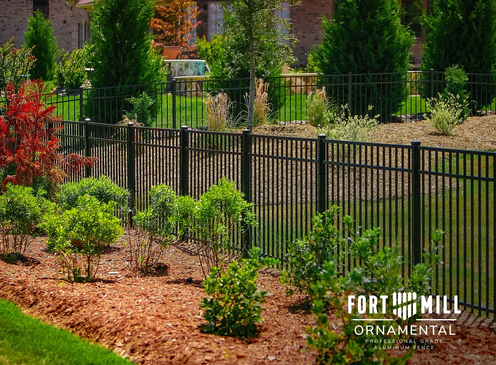 Fort Mill Ornamental Belhaven style black fence in a landscaped yard