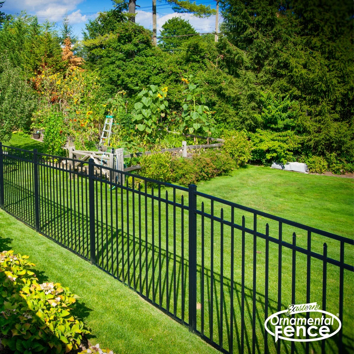Eastern Ornamental EO54202 black fence along a garden slope