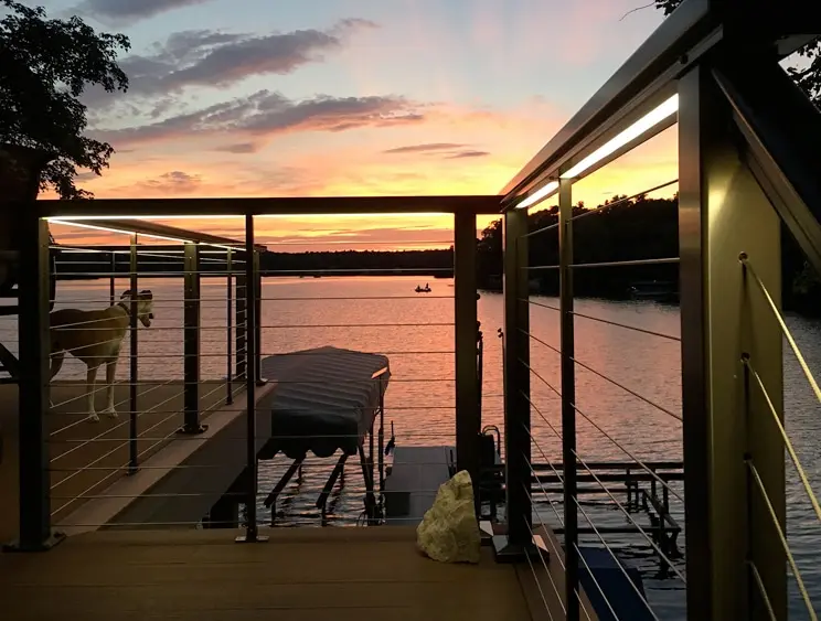 LED Lighting for DesignRail® Photo of a private dock railing with illuminated Feeney under-rail LED lighting