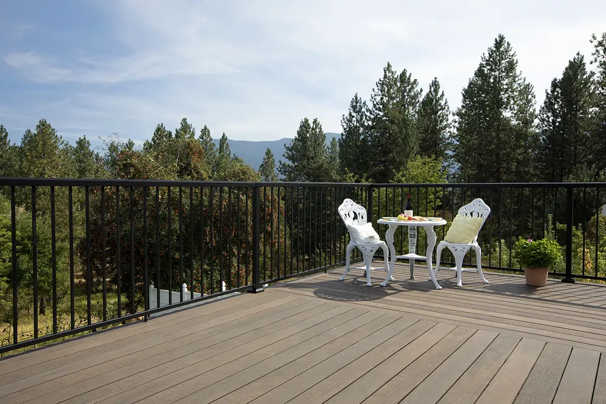 Black Fortress aluminum railing on a composite deck with seating