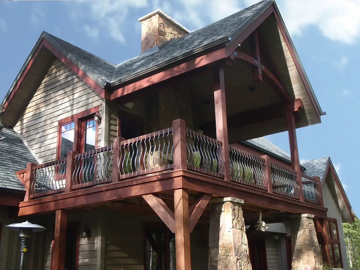 Fortress railing with scrolled balusters on a second-story deck