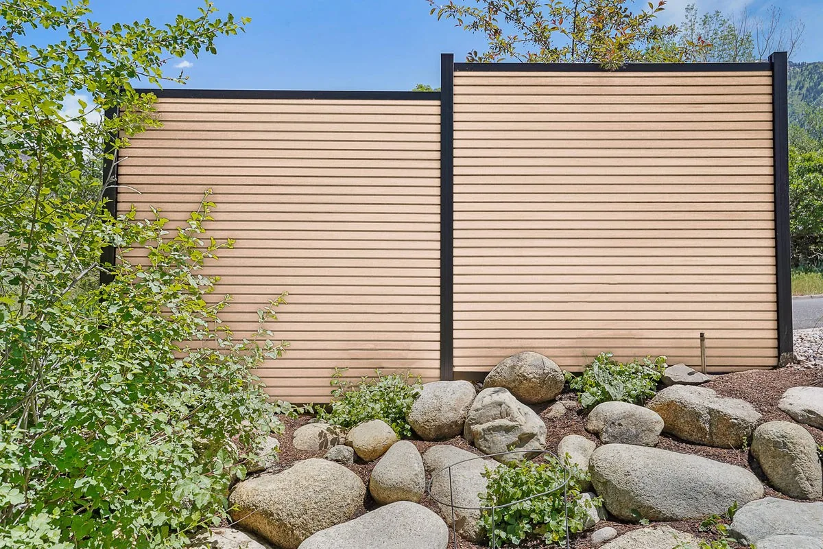 Riviera composite privacy fence panels in a light cedar color