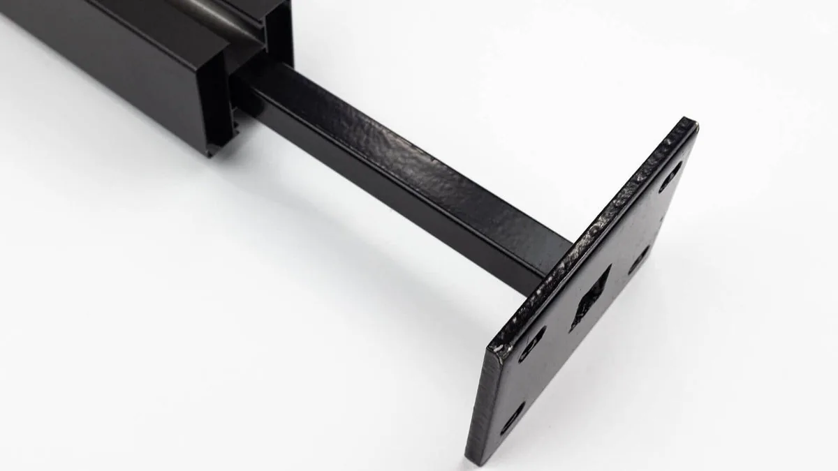 Aluminum fence post with a steel mounting plate for hard surfaces