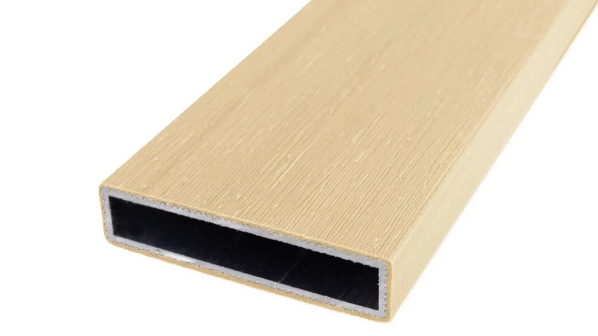 Cap Coat aluminum fence rail in a light tan wood-grain finish