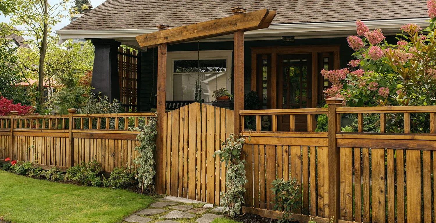 Rustic wood fence and gate at a craftsman home