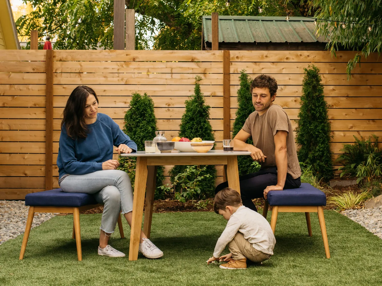 Wood privacy fence around a backyard patio