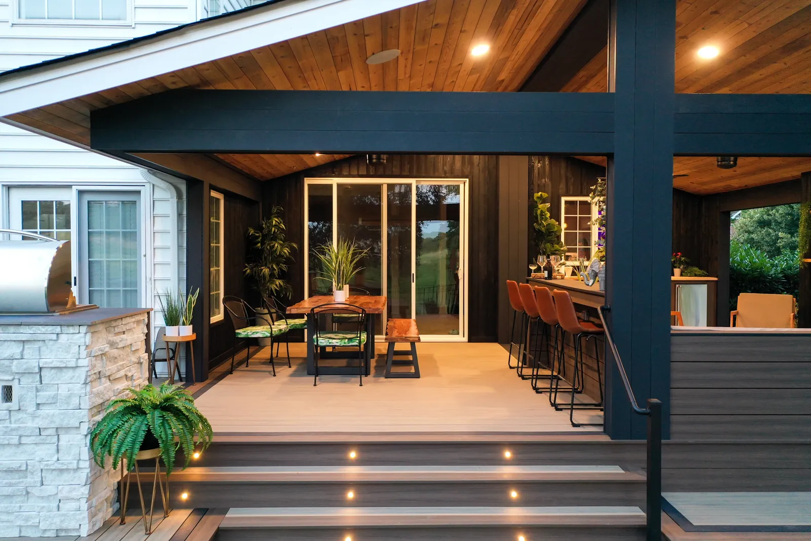 Covered deck with outdoor bar and recessed lights