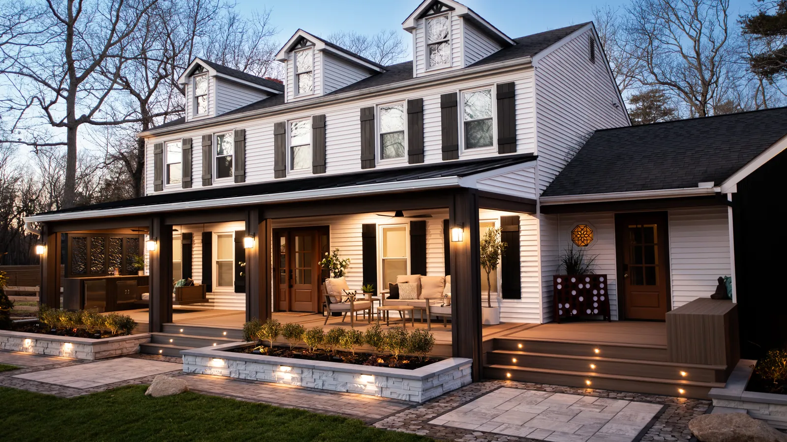 Front porch and walkway lit at dusk