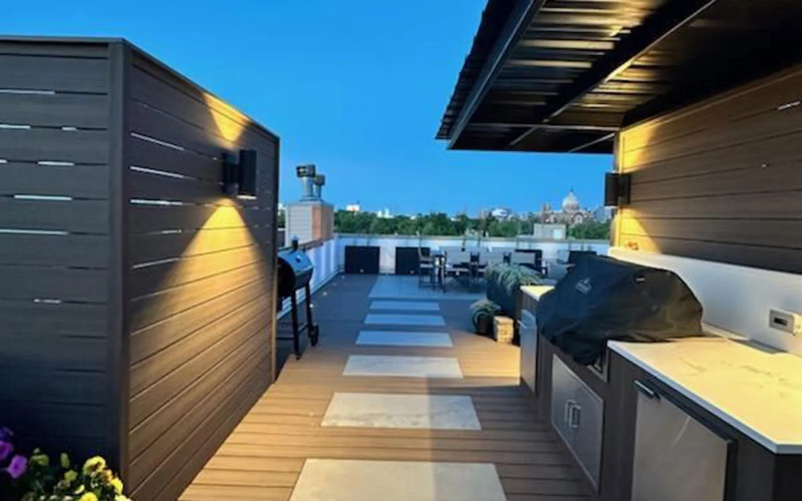 Rooftop deck with outdoor kitchen and city views
