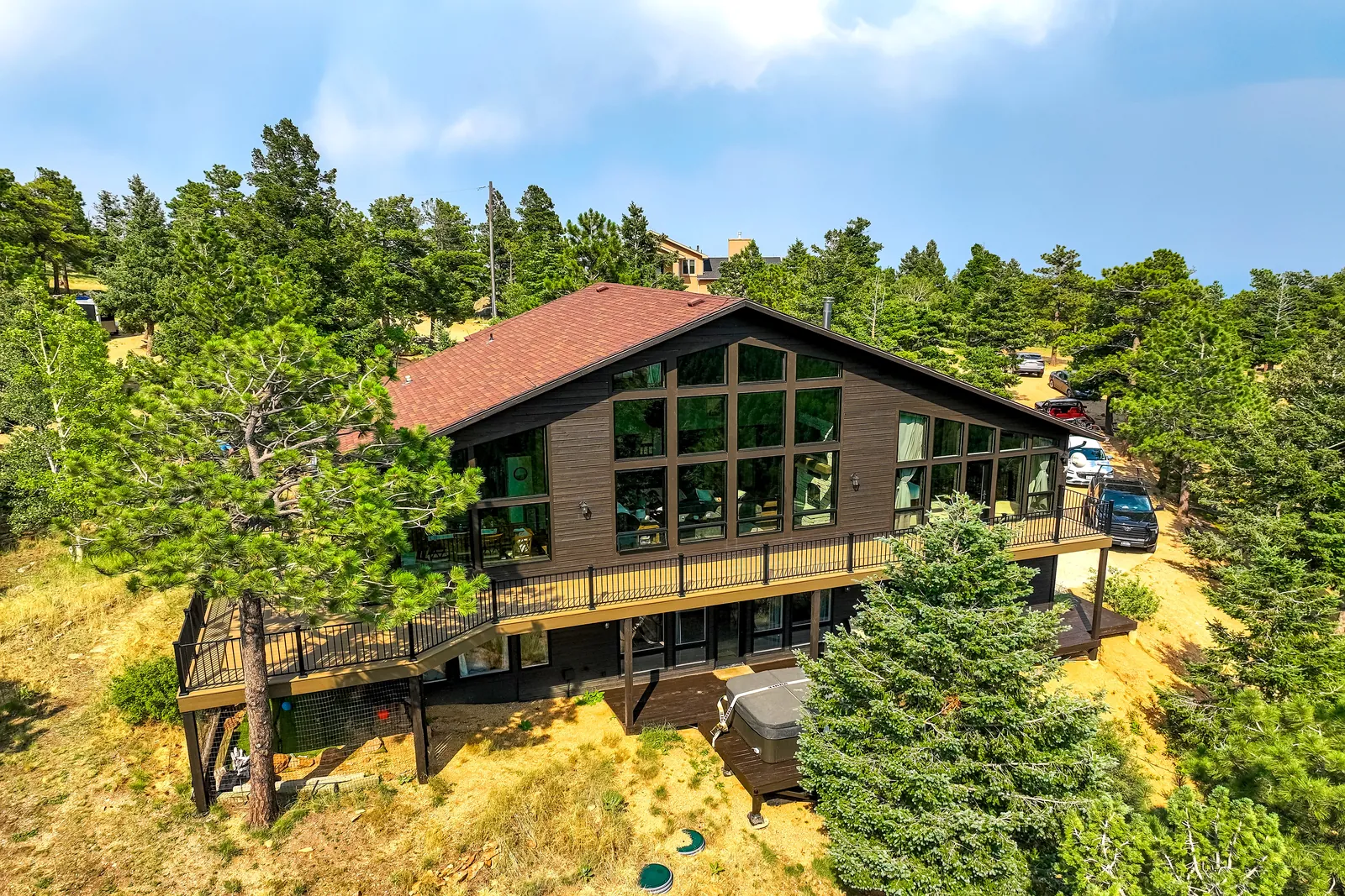 Multi-level deck wrapping a mountain home