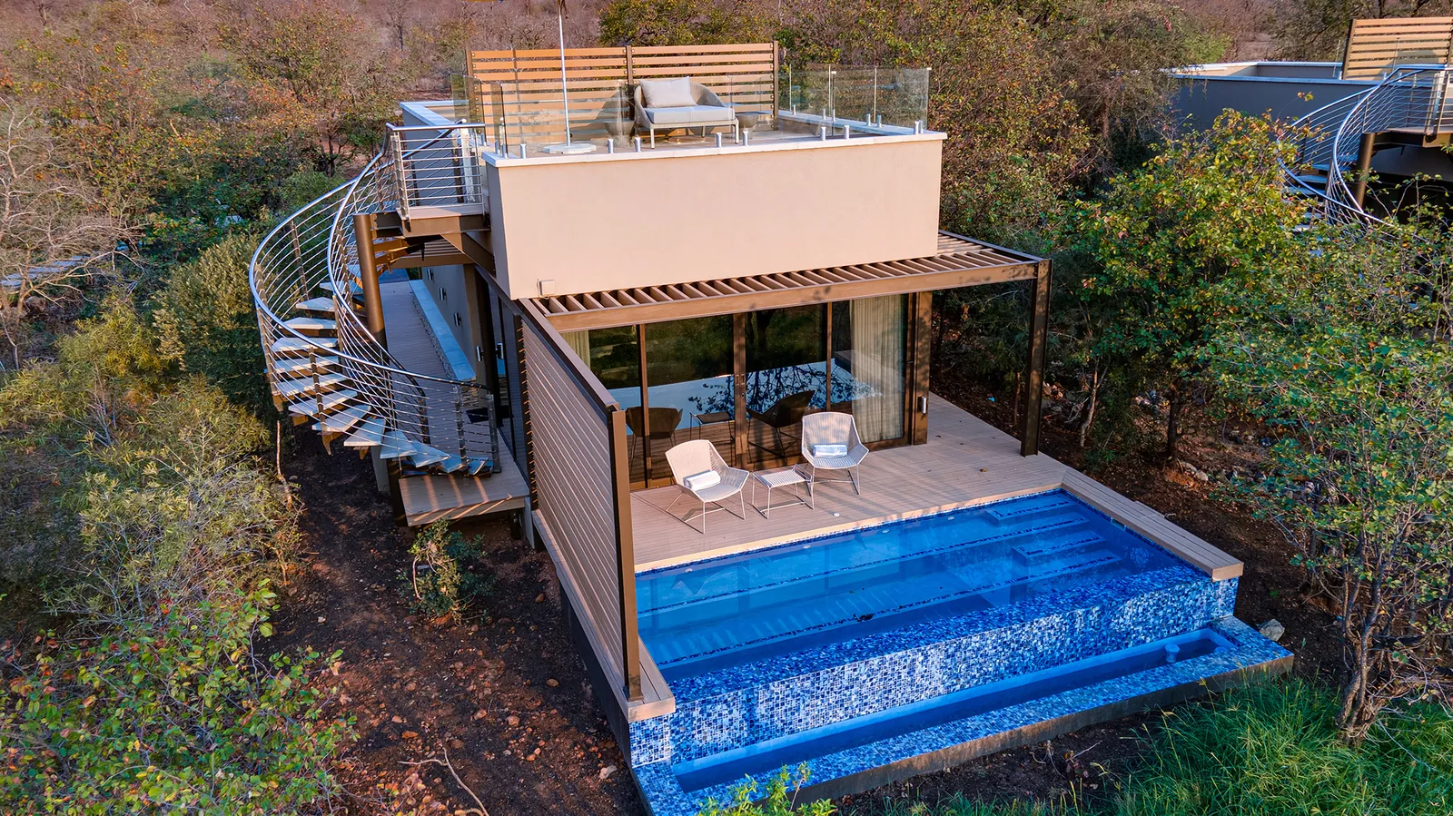 Cliffside deck with a plunge pool and spiral stair