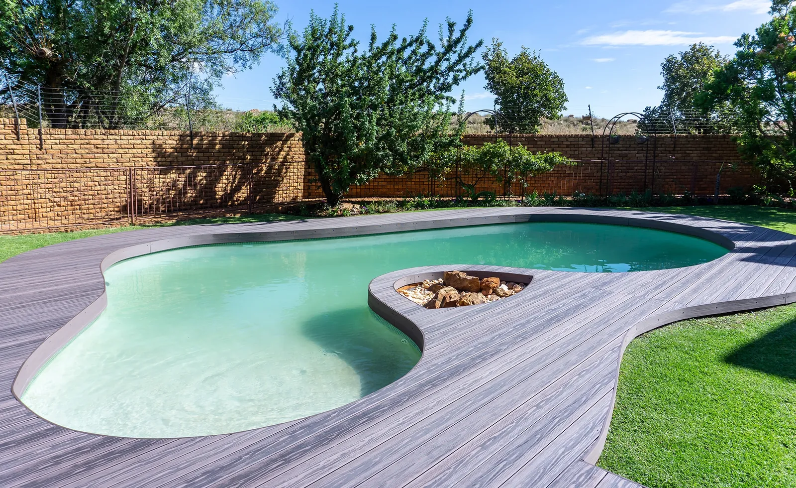 Composite deck framing a freeform pool
