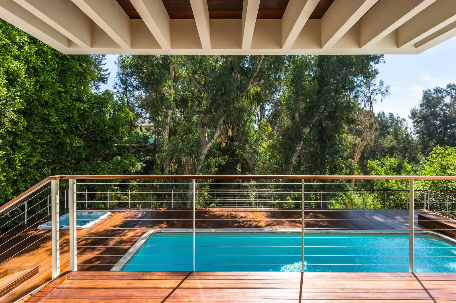 Pool deck surrounded by cable railing