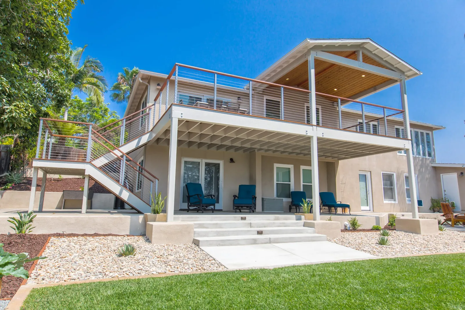 Two-story deck with cable railing and stairs