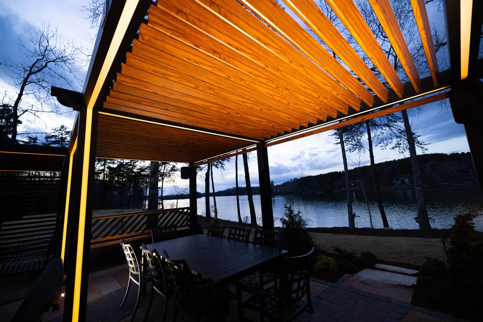 Louvered pergola with lake views