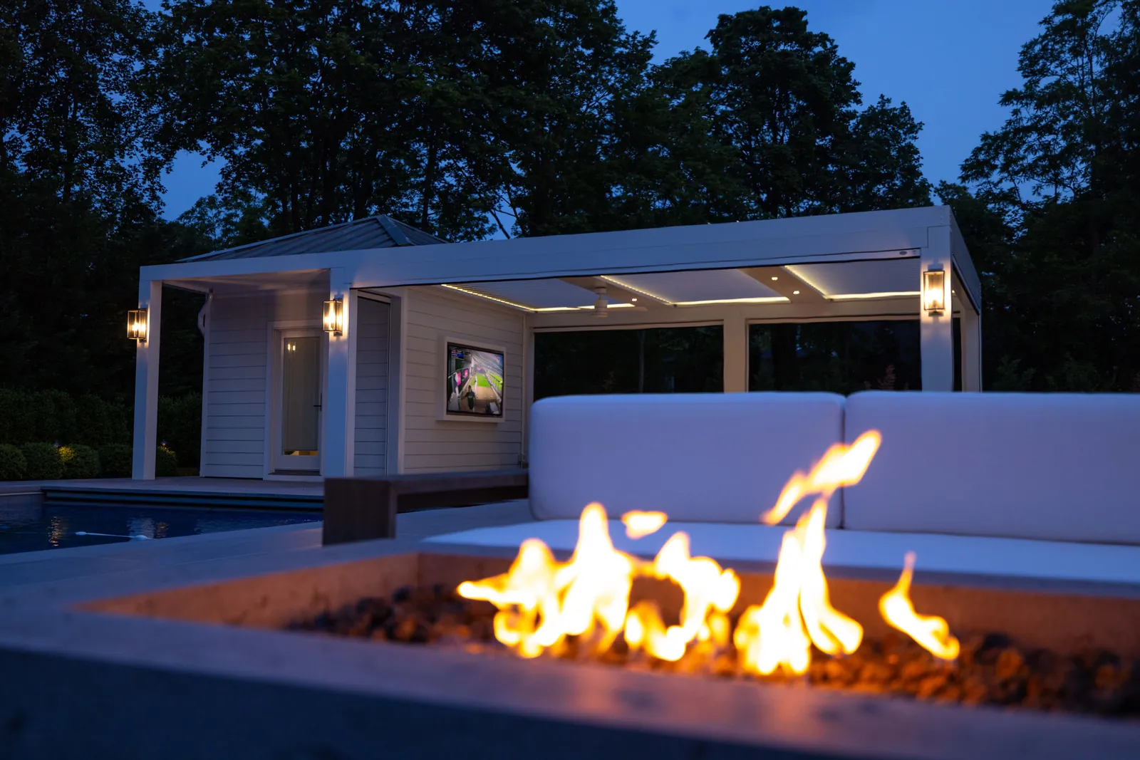 Pergola and fire pit at dusk