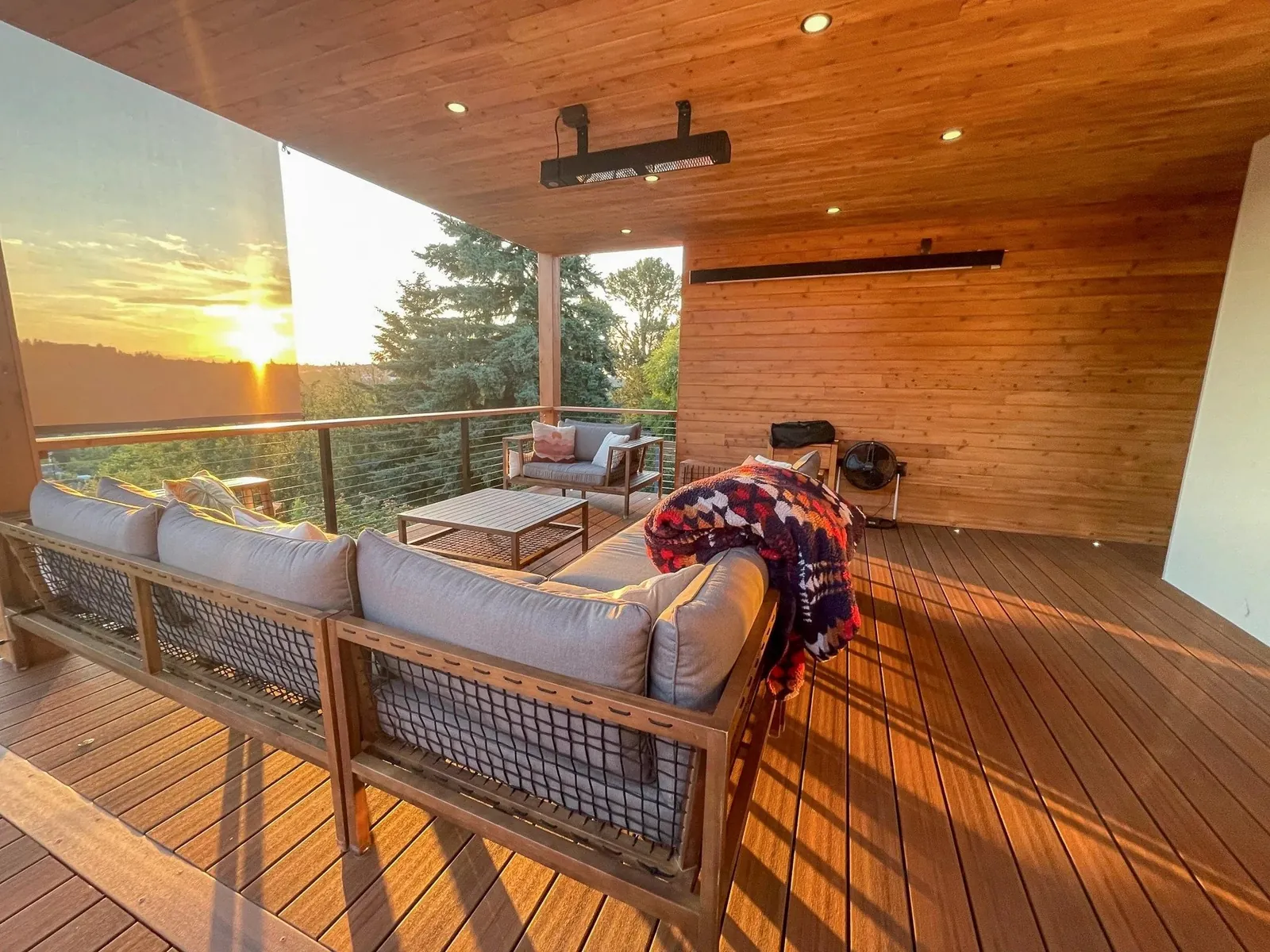 Covered deck living room at sunset