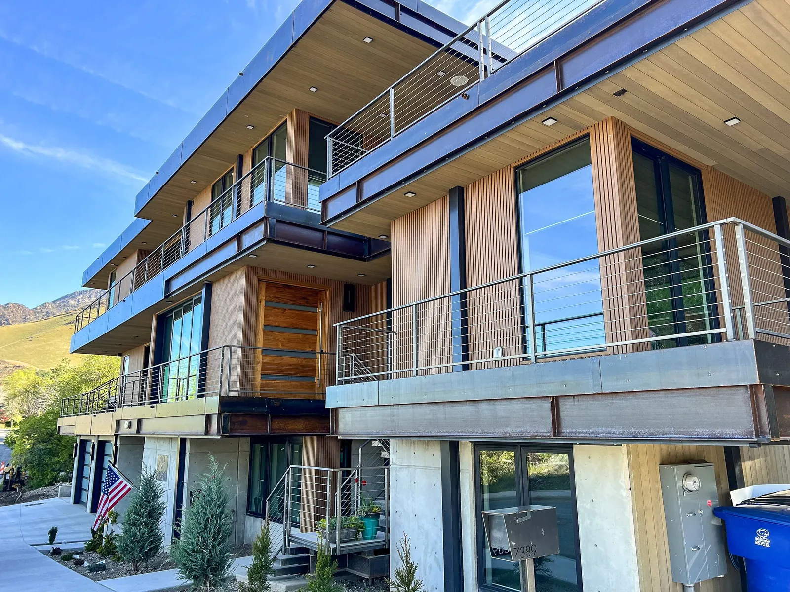 Modern home with wood-look cladding and balconies
