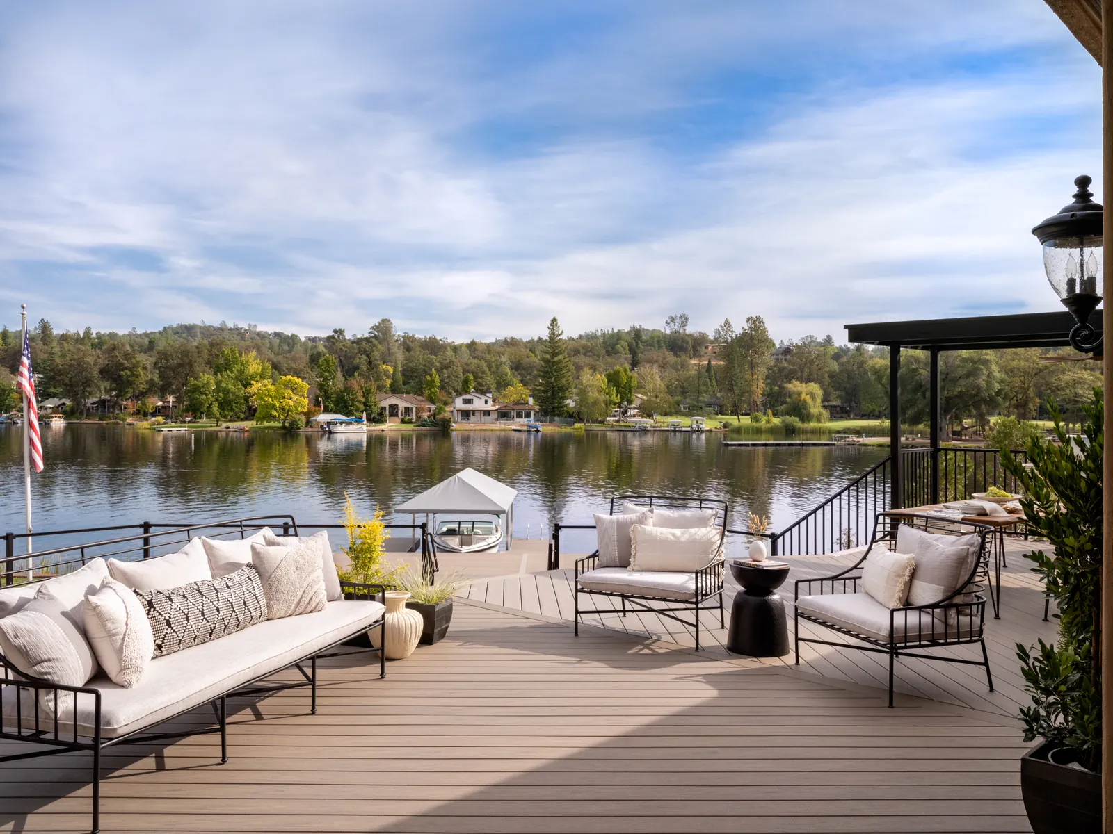 Lakefront deck with white lounge furniture
