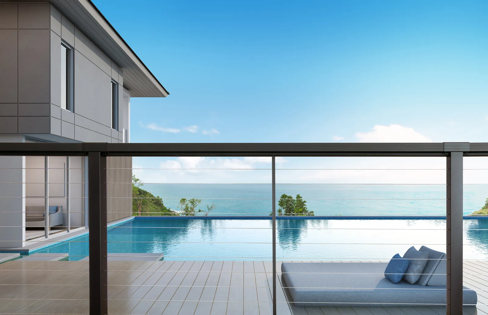 Cable railing terrace above an infinity pool and the sea