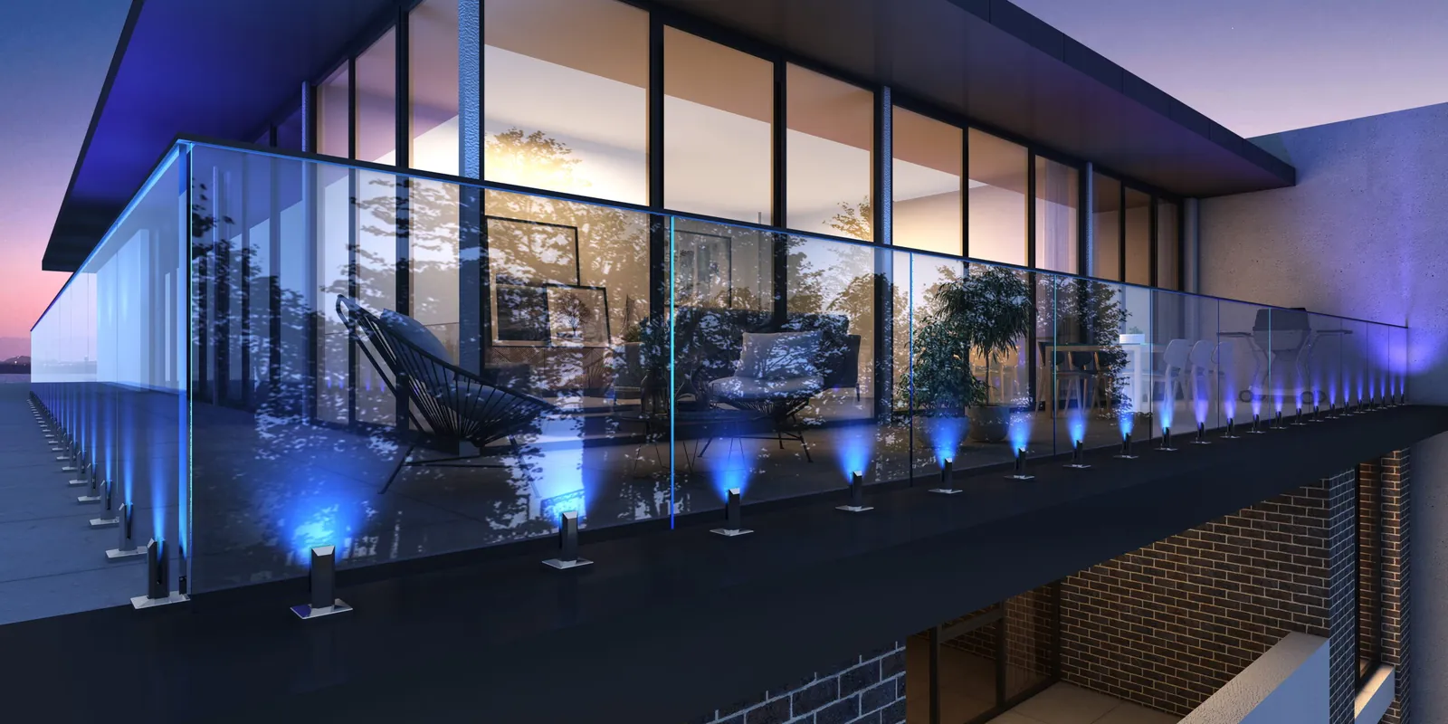 Glass railing balcony lit at night