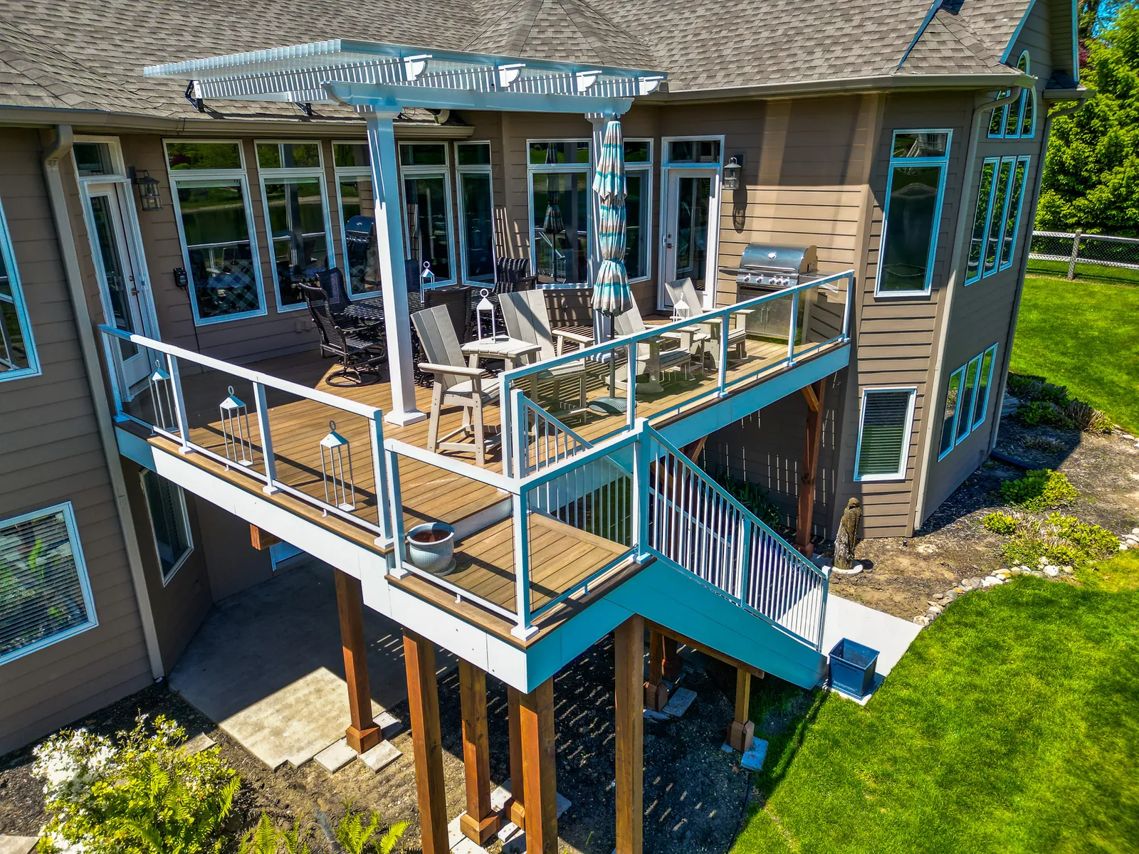 Second-story deck with framed glass railing