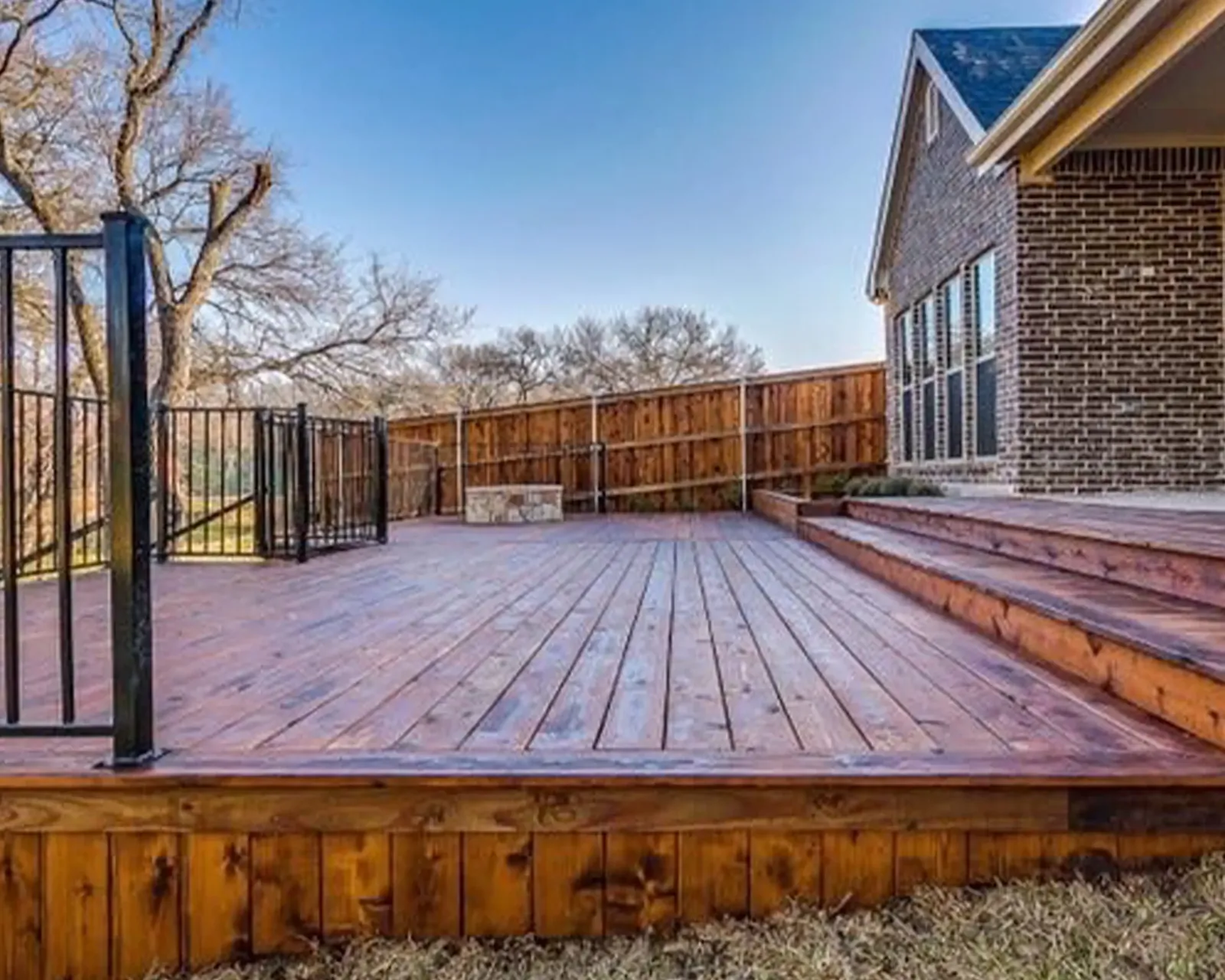 Stained wood deck and pool fence