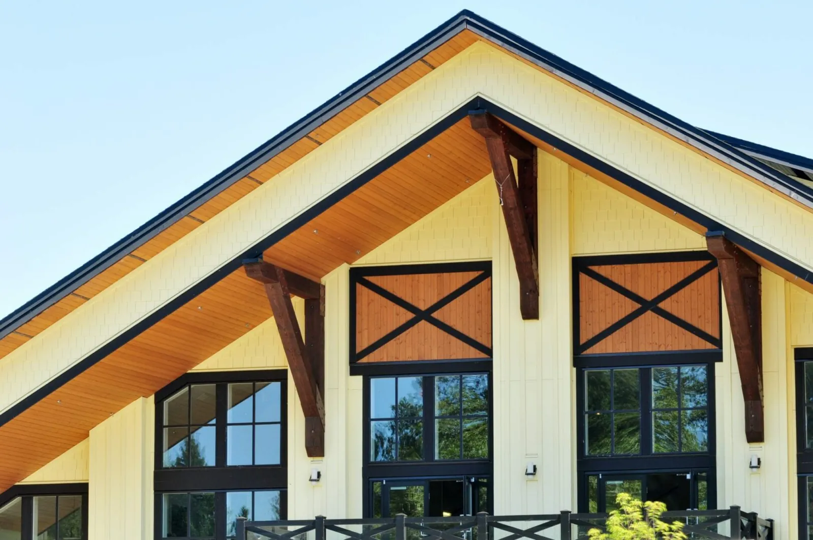 Timber-frame entry with wood-look gables