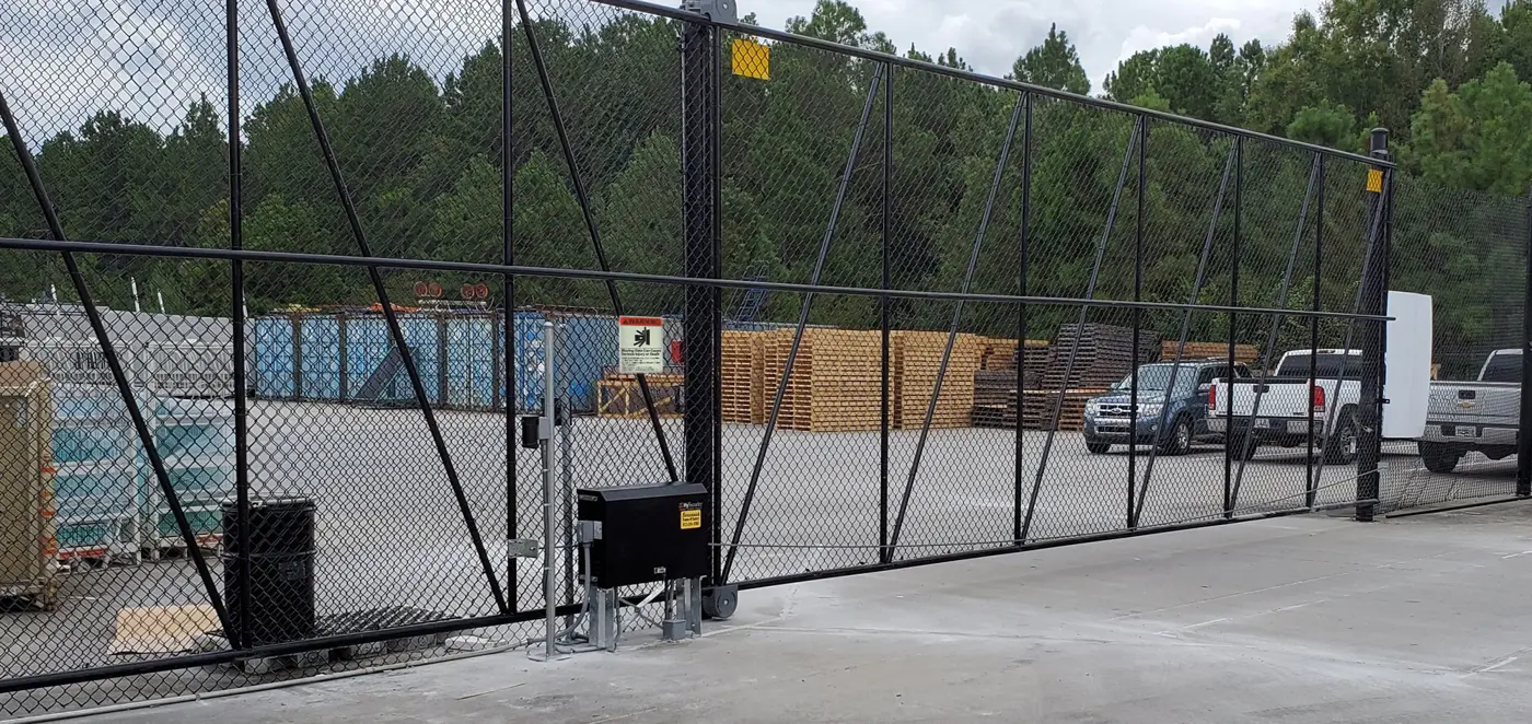 Commercial slide gate operator - slide gate operator installed on a sliding gate, HySecurity