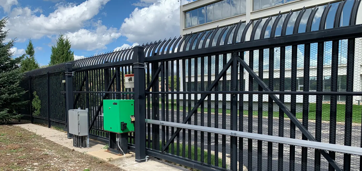 Commercial slide gate operator - slide gate operator installed on a sliding gate, HySecurity