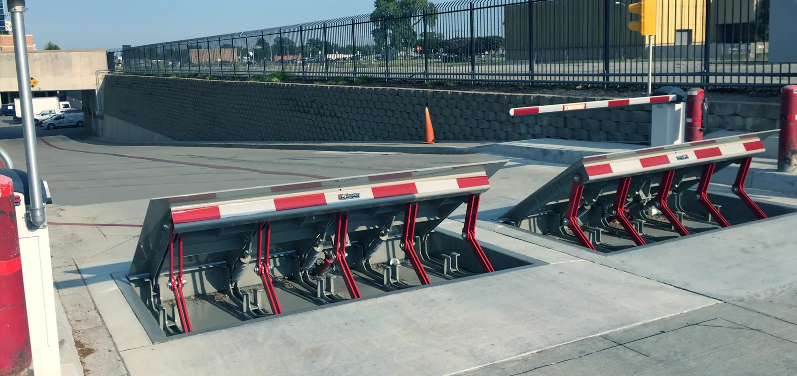 HySecurity HydraWedge crash-rated wedge barrier raised across a lane