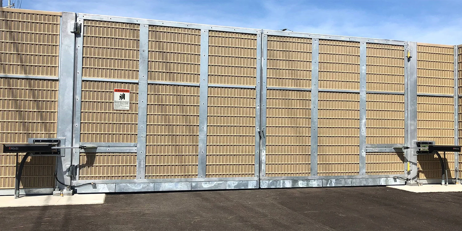 HySecurity HydraSwing hydraulic swing gate operator on a commercial gate