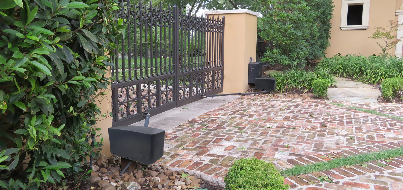 HySecurity Vanguard 3501 swing gate operator installed at a driveway gate
