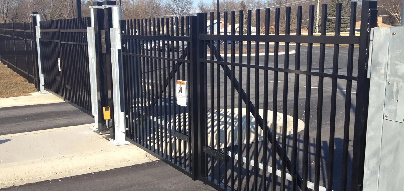 Commercial swing gate operator - swing gate operator installed on a swing gate, HySecurity